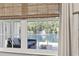 Bright view from a large window overlooking the outdoor water feature with fountain and seating area at 236 Palm Cove Circle, Myrtle Beach, SC 29588