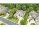 An aerial view of a beautiful home showcasing its landscaped yard, driveway, and neighborhood at 28 Grey Moss Rd., Murrells Inlet, SC 29576