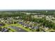 Aerial view of a neighborhood highlighting a homes location near a pond and mature trees at 28 Grey Moss Rd., Murrells Inlet, SC 29576