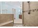 Walk-in tiled shower featuring bench and rainfall showerhead at 28 Grey Moss Rd., Murrells Inlet, SC 29576