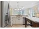 Bright kitchen featuring stainless steel appliances, granite countertops, an island, and lots of natural light at 28 Grey Moss Rd., Murrells Inlet, SC 29576