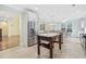 Spacious kitchen featuring an island, stainless steel fridge, granite countertops and tiled floors at 28 Grey Moss Rd., Murrells Inlet, SC 29576