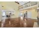 Open living room featuring hardwood floors, soaring ceilings and access to kitchen at 28 Grey Moss Rd., Murrells Inlet, SC 29576