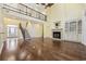 Grand living room featuring soaring ceilings, fireplace and a wrought iron railed loft at 28 Grey Moss Rd., Murrells Inlet, SC 29576