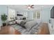 Serene main bedroom with a calming color palette, plush bed, hardwood floors, and ample natural light at 28 Grey Moss Rd., Murrells Inlet, SC 29576