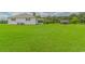 Lush, green backyard with a white home, featuring ample space and an outbuilding for storage at 2829 Highway 129, Galivants Ferry, SC 29544