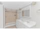 Bright bathroom with dual sinks, tile shower, and ample counter space, blending style and function at 2829 Highway 129, Galivants Ferry, SC 29544