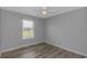 This bedroom features a ceiling fan and natural light from the window at 2829 Highway 129, Galivants Ferry, SC 29544