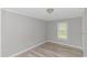A cozy bedroom featuring wood-look flooring and a bright window at 2829 Highway 129, Galivants Ferry, SC 29544