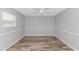 This bedroom has vinyl flooring and a light-filled window at 2829 Highway 129, Galivants Ferry, SC 29544