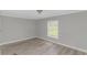 A cozy bedroom featuring wood-look flooring and a bright window at 2829 Highway 129, Galivants Ferry, SC 29544