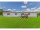Charming home exterior with well-maintained lawn, featuring a welcoming front porch and freshly painted facade at 2829 Highway 129, Galivants Ferry, SC 29544