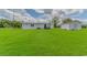 Exterior of home with green grass, detached garage, and metal roof at 2829 Highway 129, Galivants Ferry, SC 29544