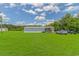 Property with a house, green grass, and a few parked cars at 2829 Highway 129, Galivants Ferry, SC 29544