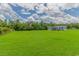 Sprawling green property with a house and tree line in background at 2829 Highway 129, Galivants Ferry, SC 29544