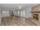 Open-concept living room with fireplace and access to updated kitchen and outdoor area at 2829 Highway 129, Galivants Ferry, SC 29544