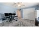 Bedroom features blue walls, hardwood floors, and black work station with triple monitors and rolling chair at 2885 Desert Rose St., Little River, SC 29566