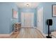 Welcoming foyer with hardwood floors, a console table, stylish lighting, and a bright, airy feel at 2885 Desert Rose St., Little River, SC 29566