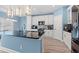 Contemporary kitchen featuring white cabinets, stainless steel appliances, and a central island with bar seating at 2885 Desert Rose St., Little River, SC 29566
