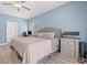 Calming bedroom featuring a large bed, neutral color palette, ceiling fan, and a work area with a computer at 2885 Desert Rose St., Little River, SC 29566