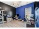Modern office space with a desk, chair, large cat tower, and a blue accent wall at 2885 Desert Rose St., Little River, SC 29566