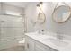 Modern bathroom featuring double sinks, quartz counters, and a glass-enclosed shower and tub at 294 Splendor Circle, Murrells Inlet, SC 29576