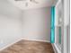 Bedroom with wood-look floors, a window with blue curtains, and light gray walls at 294 Splendor Circle, Murrells Inlet, SC 29576