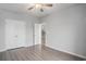 A spacious bedroom offers wood-look floors, white doors, and light gray walls at 294 Splendor Circle, Murrells Inlet, SC 29576