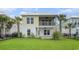 Two-story home with yellow siding, white trim, and a covered back porch at 294 Splendor Circle, Murrells Inlet, SC 29576