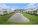 Community pond view showing lush landscaping and charming home exteriors at 294 Splendor Circle, Murrells Inlet, SC 29576