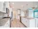 Modern kitchen featuring granite countertops, stainless steel appliances, and white cabinetry at 294 Splendor Circle, Murrells Inlet, SC 29576