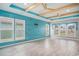 Bright living room with wood-look flooring, wood beam ceiling, and lots of natural light at 294 Splendor Circle, Murrells Inlet, SC 29576