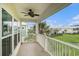 Charming patio view showcasing meticulously maintained lawn with palm trees and neighborhood homes in the background at 294 Splendor Circle, Murrells Inlet, SC 29576