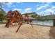 Community playground with a swing set, jungle gym, and sand, perfect for outdoor activities at 294 Splendor Circle, Murrells Inlet, SC 29576