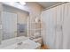 Neutral bathroom featuring a shower, a white shelving unit, and a vanity with a mirror at 3307 Nixon St., North Myrtle Beach, SC 29582