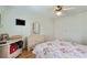 Traditional bedroom with light green walls, ceiling fan, dresser, TV and floral bedding at 3307 Nixon St., North Myrtle Beach, SC 29582