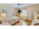 Comfortable bedroom featuring a colorful quilt, wooden floors, and ample natural light at 3307 Nixon St., North Myrtle Beach, SC 29582