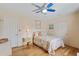 Bright bedroom featuring a ceiling fan, wood floors, and colorful bedding at 3307 Nixon St., North Myrtle Beach, SC 29582