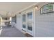 Charming front porch with a cozy swing, ideal for relaxation and enjoying the coastal ambiance at 3307 Nixon St., North Myrtle Beach, SC 29582