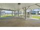 View of the outdoor entertaining space on the ground level with covered picnic table and parking at 3307 Nixon St., North Myrtle Beach, SC 29582