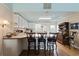 An inviting kitchen offers a breakfast bar with seating, ample counter space, and storage at 3307 Nixon St., North Myrtle Beach, SC 29582