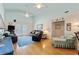 Inviting living room with bright vaulted ceilings, ceiling fans, French doors to the outdoor balcony at 3307 Nixon St., North Myrtle Beach, SC 29582