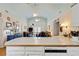 Living area adjacent to the kitchen with ceiling fans, table, TV, and lamps at 3307 Nixon St., North Myrtle Beach, SC 29582