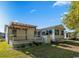 Backyard with a covered deck and lush lawn, offering an outdoor oasis at 333 Walden Lake Rd., Conway, SC 29526
