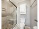 Bathroom with walk-in tiled shower with glass enclosure, gray walls and tile flooring at 333 Walden Lake Rd., Conway, SC 29526