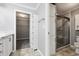 Bathroom featuring a spacious vanity, cabinetry, walk-in closet, and glass-enclosed shower at 333 Walden Lake Rd., Conway, SC 29526