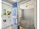 Entrance to bedroom with blue door and open entry; ceiling fan and window are present at 333 Walden Lake Rd., Conway, SC 29526