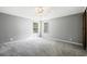 Spacious bedroom with plush carpeting, neutral walls, and large windows, with ample natural light at 333 Walden Lake Rd., Conway, SC 29526