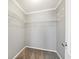 Walk-in closet with gray walls, carpeted floor, wire shelving and door to the main bathroom at 333 Walden Lake Rd., Conway, SC 29526
