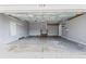 Spacious two car garage with sealed concrete flooring and overhead lighting at 333 Walden Lake Rd., Conway, SC 29526